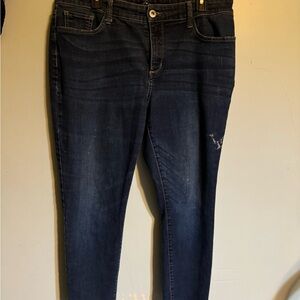 St.John Bay jeans with a bleach stain on the upper leg stretch bark blue